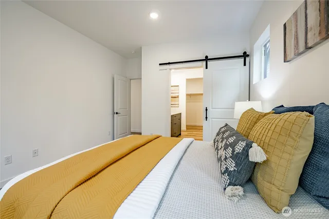 a bedroom with a bed and a closet