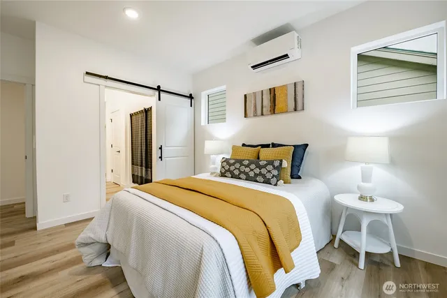 a bedroom with a bed and a table