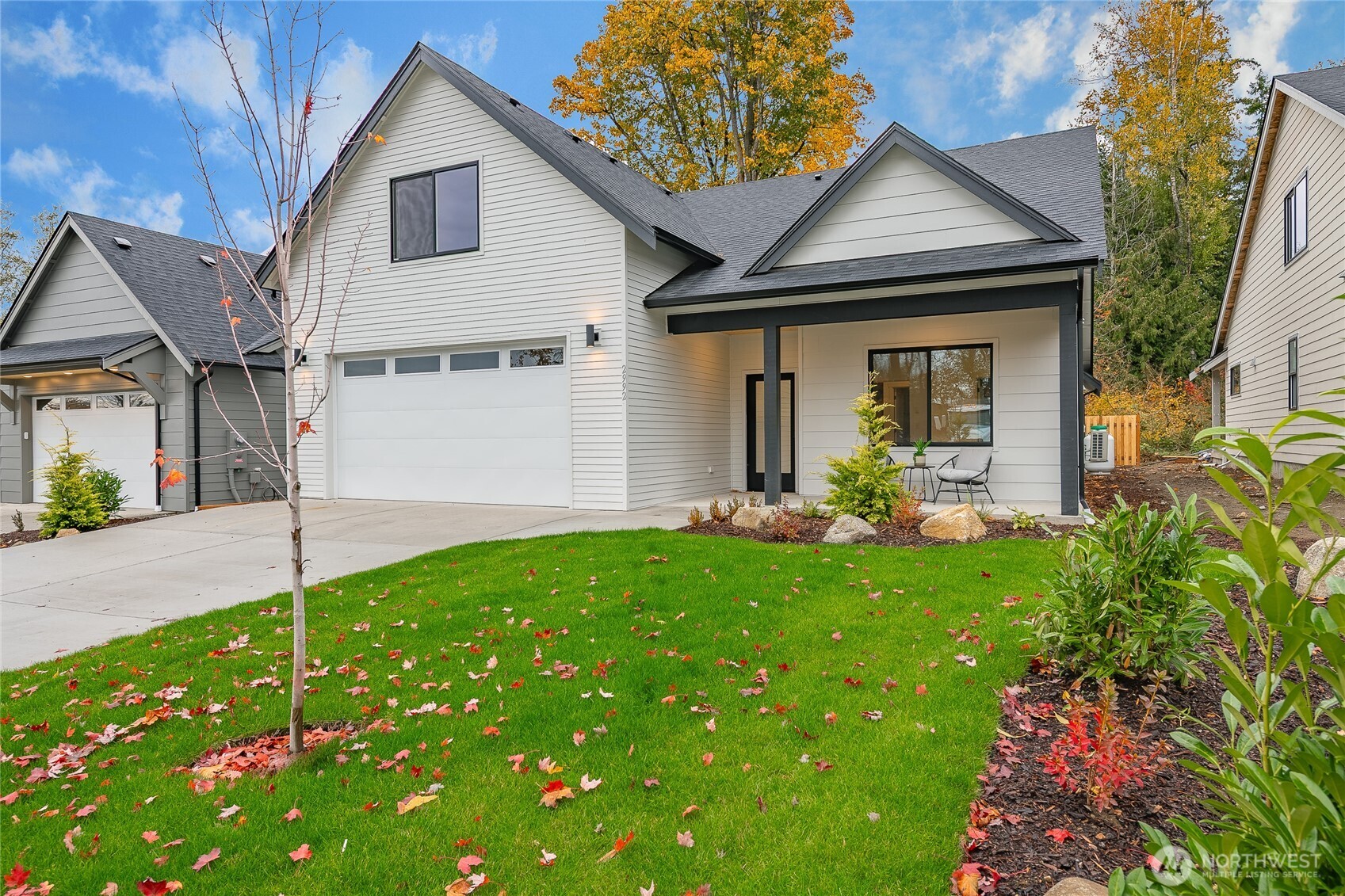 2992 Cedar View Road Blaine, WA 98230 - Photo 2 of 39 a front view of a house with a yard and potted plants