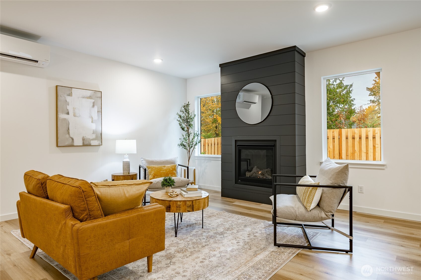 2992 Cedar View Road Blaine, WA 98230 - Photo 8 of 39 a living room with furniture a clock and a fireplace