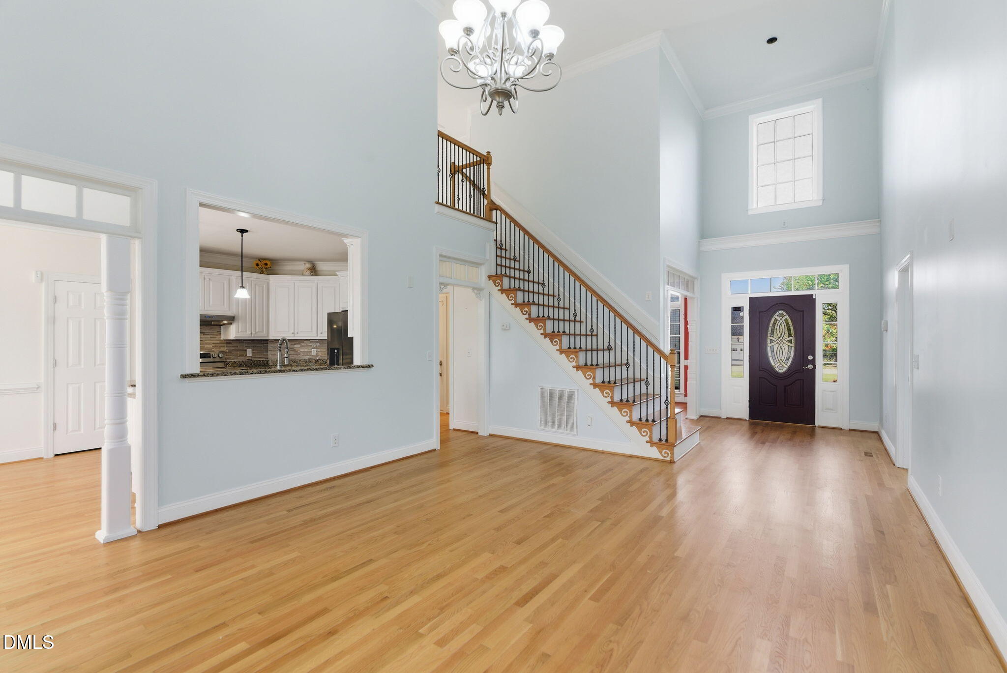 19 Silverside Drive Angier, NC 27501 - Photo 14 of 73 a view of a hallway with wooden floor and staircase