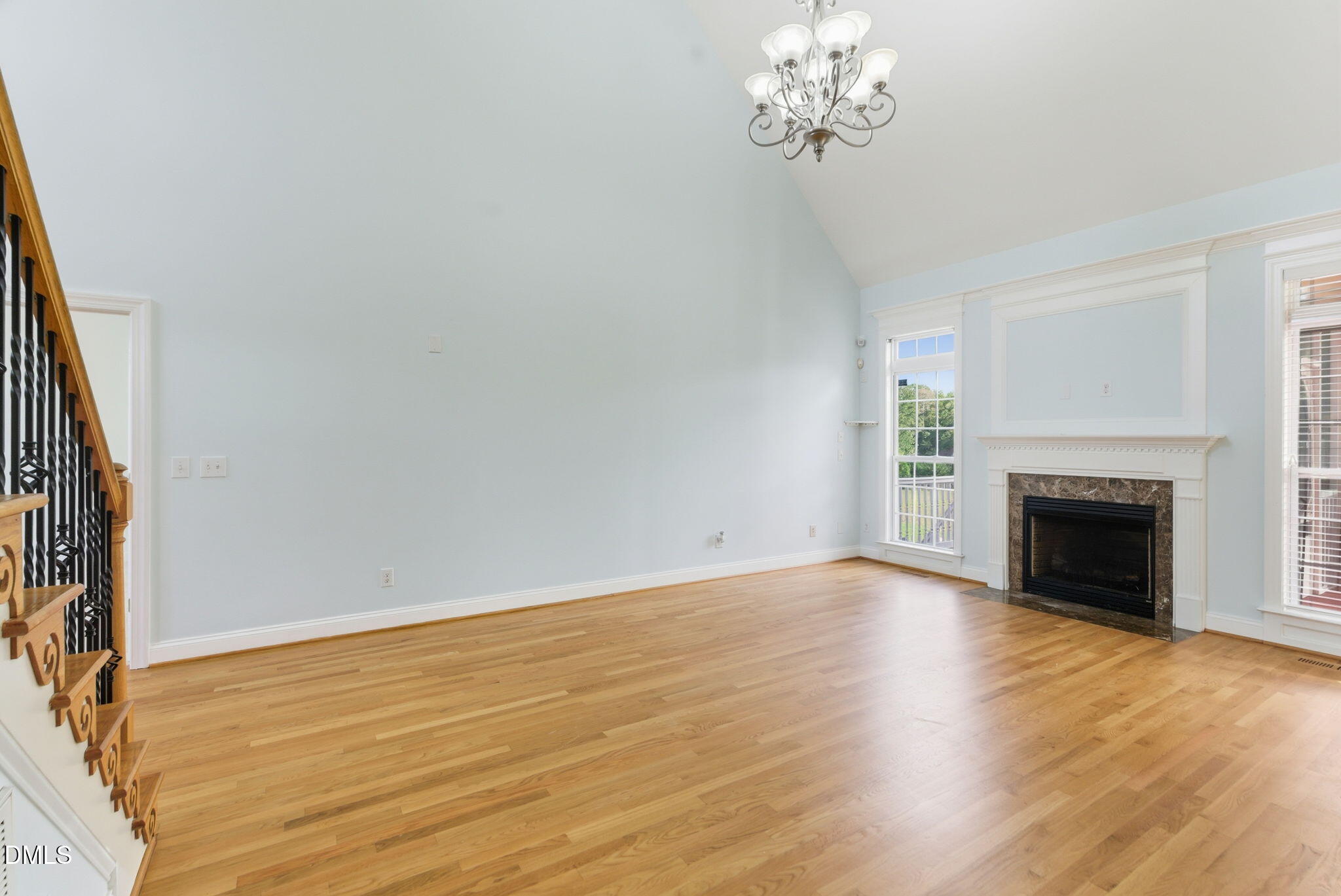 19 Silverside Drive Angier, NC 27501 - Photo 16 of 73 a view of an empty room with wooden floor and a window