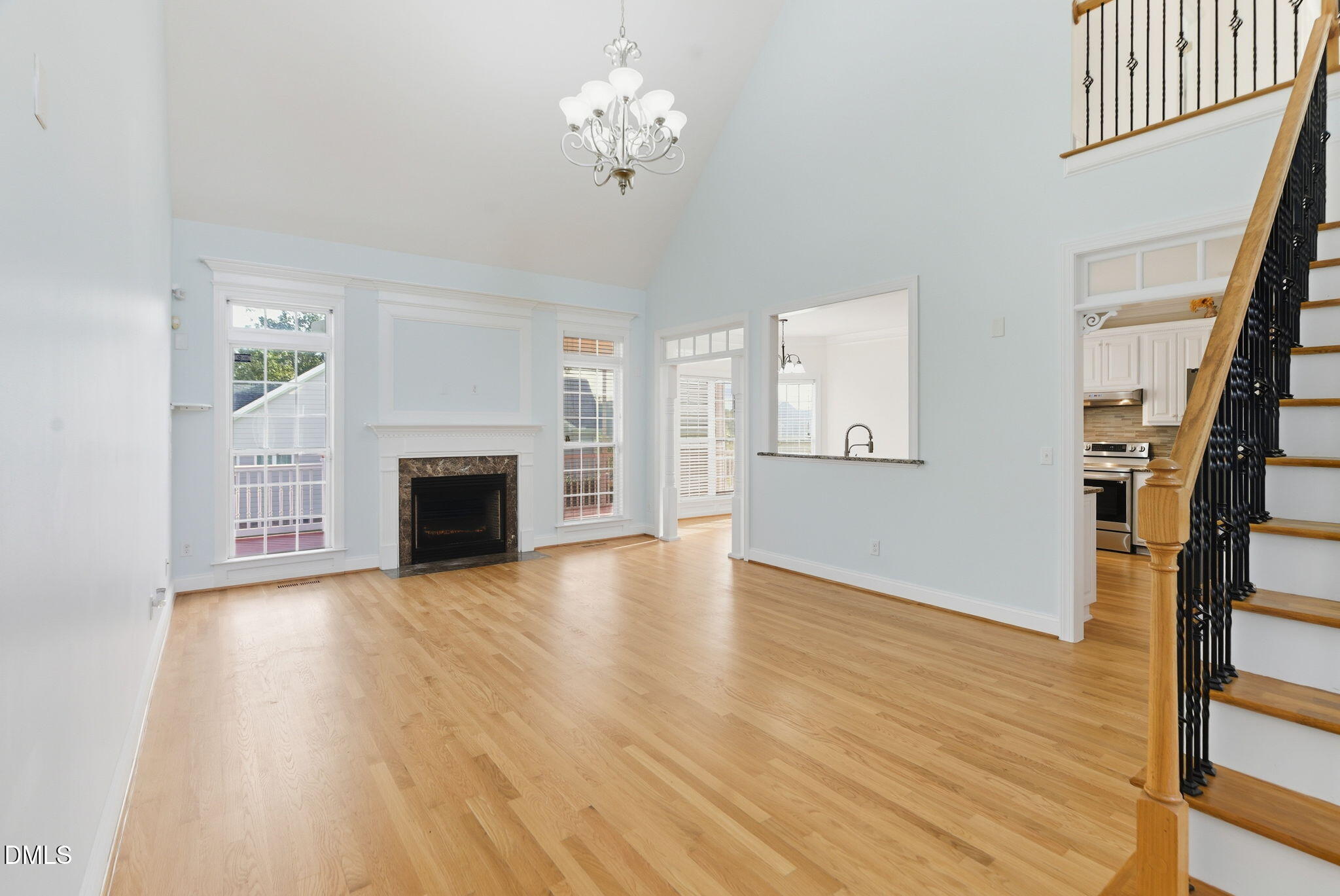 19 Silverside Drive Angier, NC 27501 - Photo 17 of 73 a view of empty room with wooden floor and fireplace