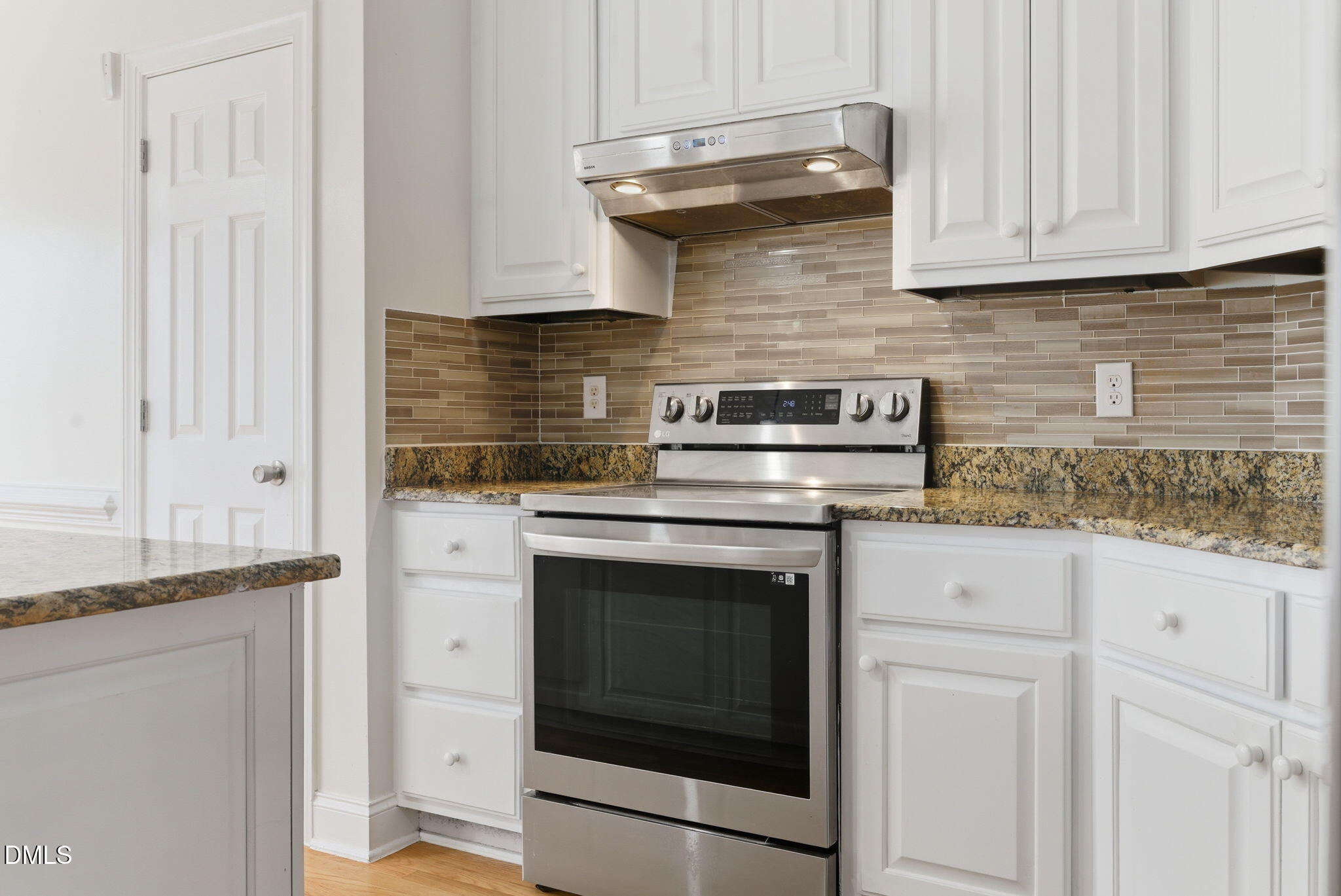 19 Silverside Drive Angier, NC 27501 - Photo 23 of 73 a kitchen with granite countertop white cabinets and white appliances