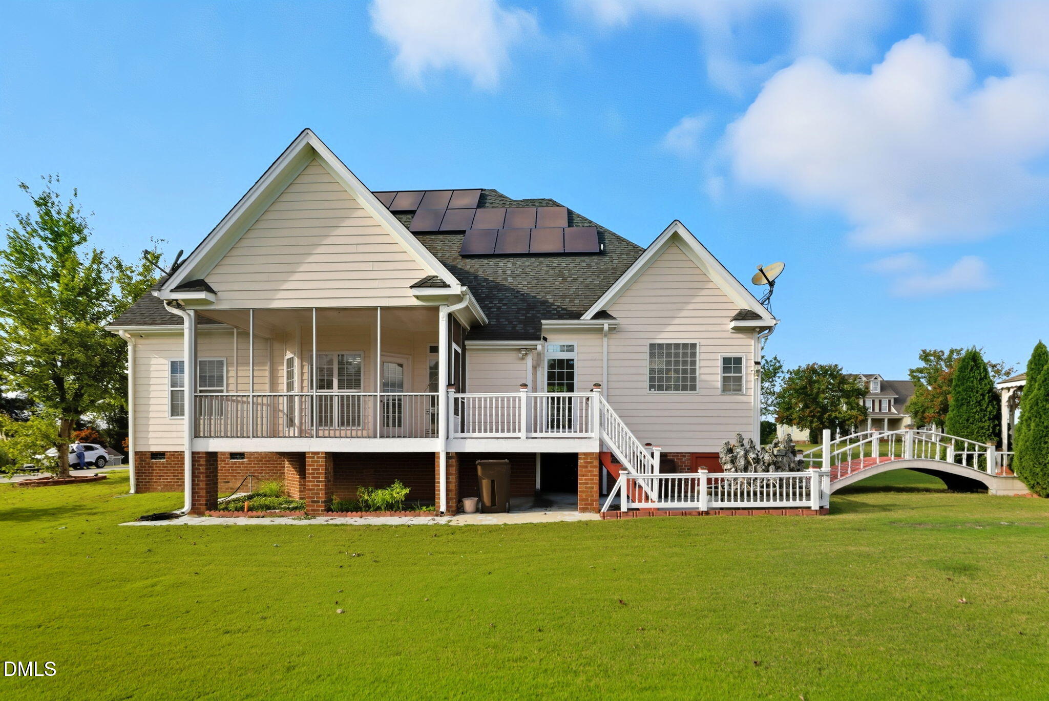 19 Silverside Drive Angier, NC 27501 - Photo 58 of 73 a view of a white house with a yard and potted plants
