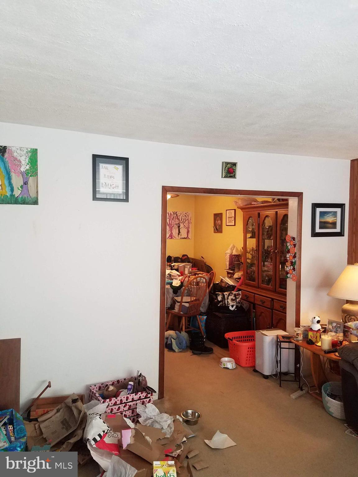 1710 Pin Oak Road Baltimore, MD 21234 - Photo 2 of 5 a bedroom with furniture and a large window