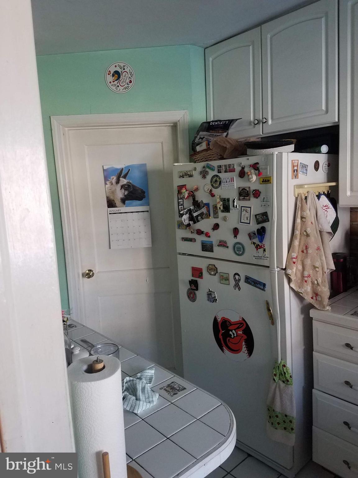 1710 Pin Oak Road Baltimore, MD 21234 - Photo 4 of 5 a bathroom with a refrigerator and a stove