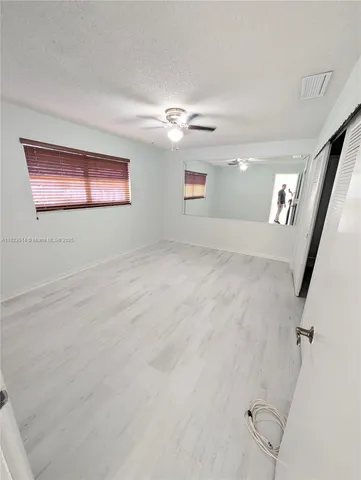 a view of a hallway with closet
