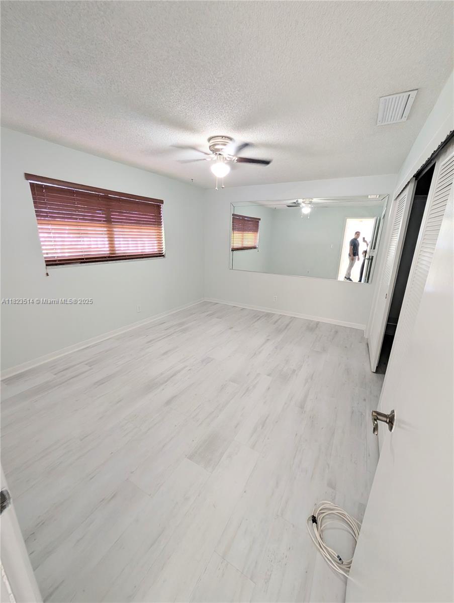 14901 Southwest 4th Street, Unit 9A Pembroke Pines, FL 33027 - Photo 11 of 35 a view of a hallway with closet