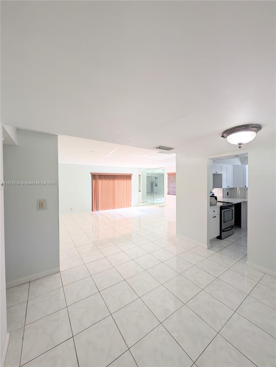 14901 Southwest 4th Street, Unit 9A Pembroke Pines, FL 33027 - Photo 28 of 35 a view of an empty room with a window