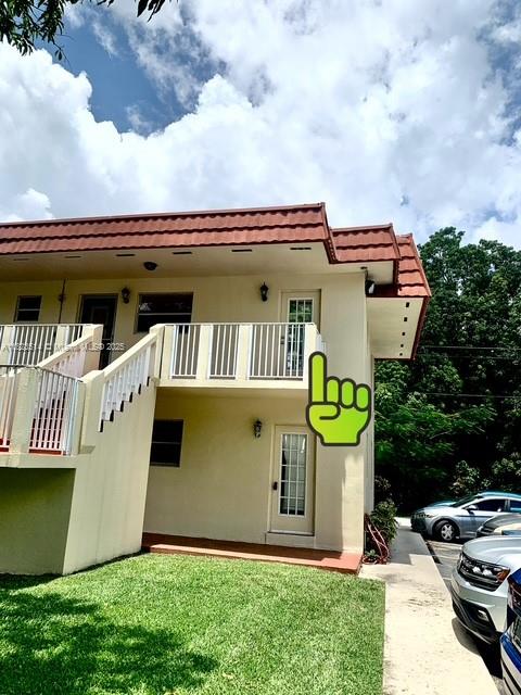14901 Southwest 4th Street, Unit 9A Pembroke Pines, FL 33027 - Photo 35 of 35 a front view of a house with garden