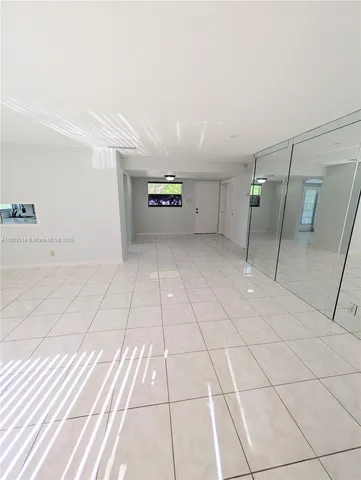 a view of a livingroom with an empty space and a sink