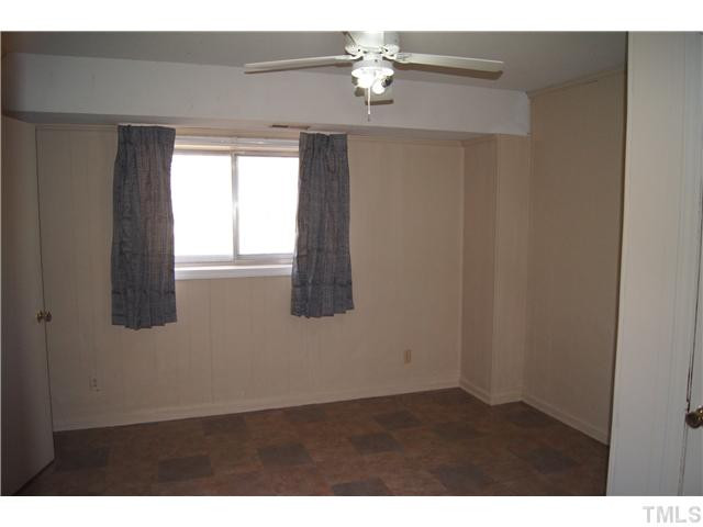 904 Windcrest Road Durham, NC 27713 - Photo 19 of 25 Lower Level Bedroom with access to a bathroom Bedroom