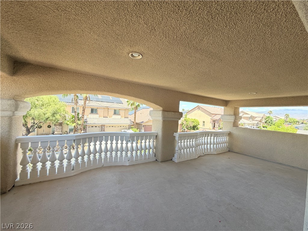 6116 Rabbit Track Street Las Vegas, NV 89130 - Photo 23 of 28 A spacious covered balcony provides an elevated outdoor retreat with community views.