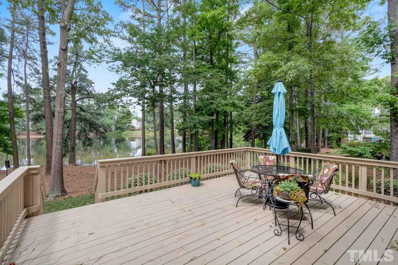 8601 Wheeling Drive Raleigh, NC 27615 - Photo 23 of 25 a view of a deck with furniture and wooden deck