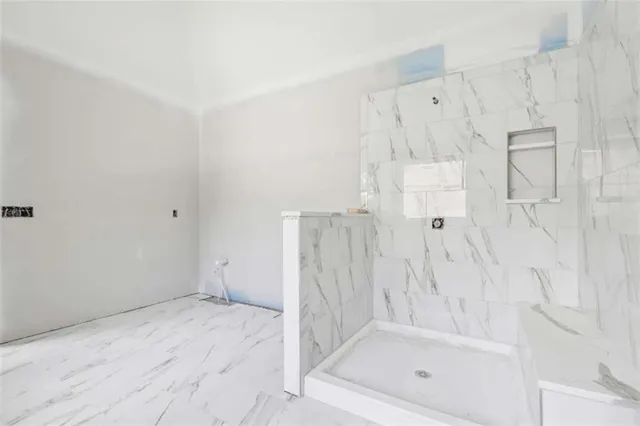 a white bath tub sitting next to a window