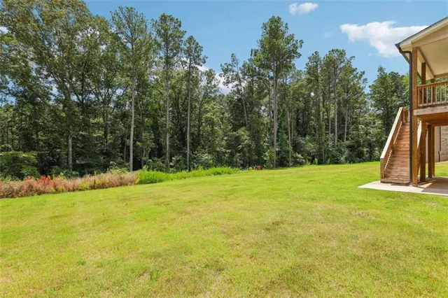 a front view of a house with a yard table and chairs