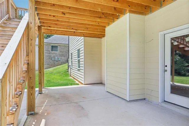an aerial view of a house with garden space and ocean view