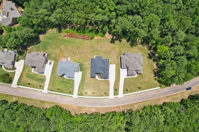 a view of a house with a yard and a fence