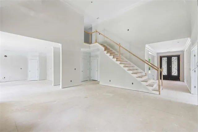 a view of an empty room with stairs