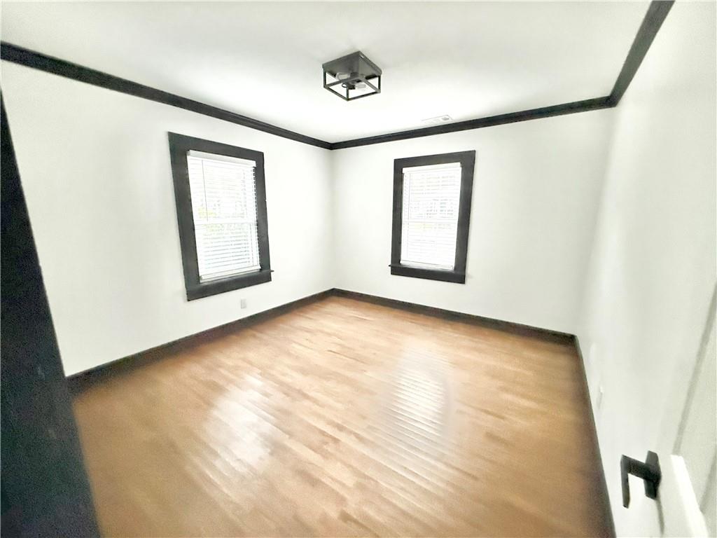 1802 South Gordon Street Southwest Atlanta, GA 30310 - Photo 6 of 14 a view of an empty room with windows