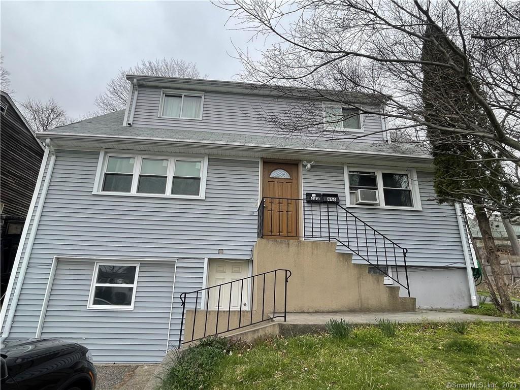 444 Merritt Street Bridgeport, CT 06606 - Photo 1 of 1 a front view of a house with a yard