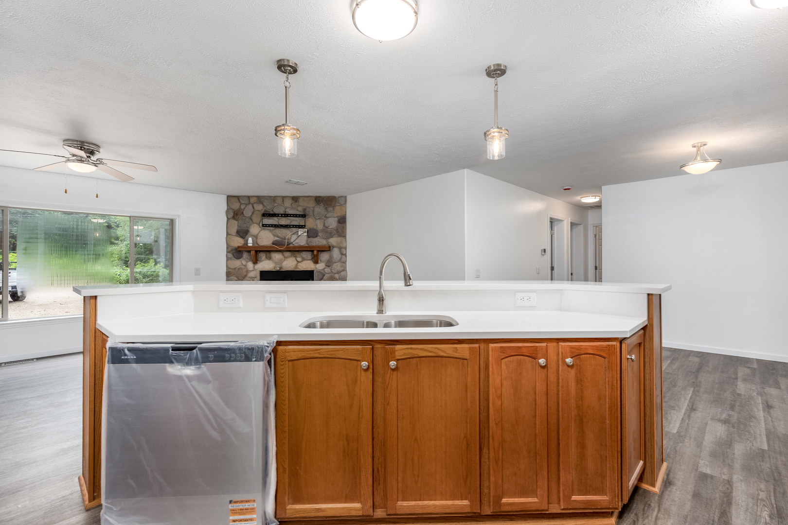 931 Highway 26 Magnolia, IL 61336 - Photo 11 of 35 a kitchen with kitchen island a sink stainless steel appliances and a fireplace