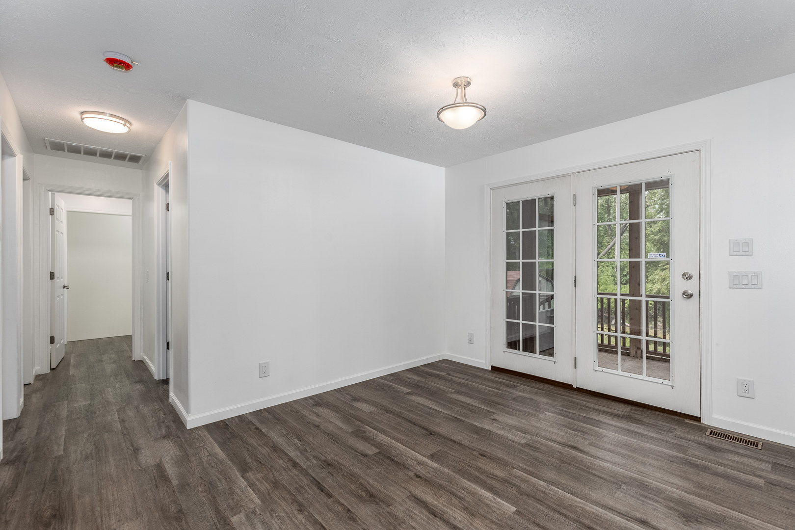 931 Highway 26 Magnolia, IL 61336 - Photo 12 of 35 wooden floor in an empty room with a window