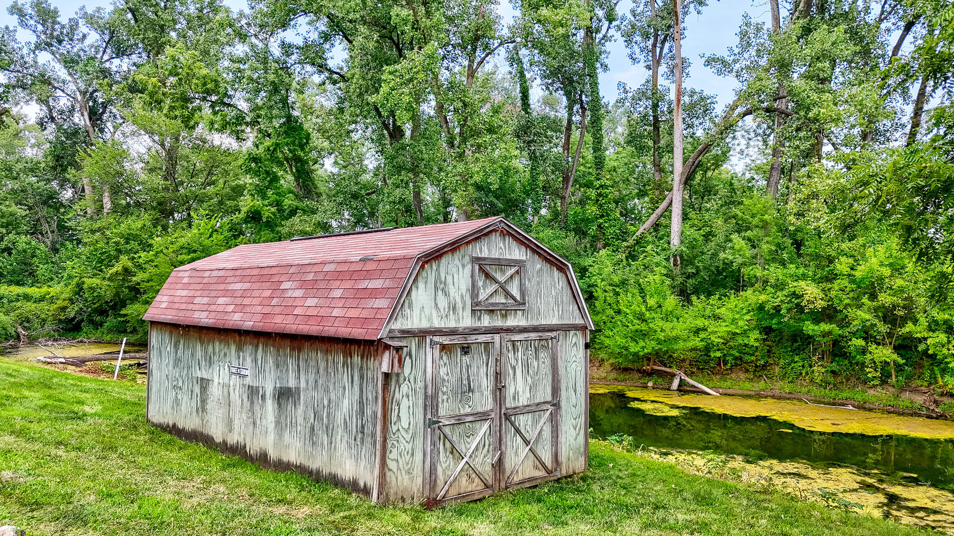 931 Highway 26 Magnolia, IL 61336 - Photo 26 of 35 a view of a tiny house with a yard and wooden fence