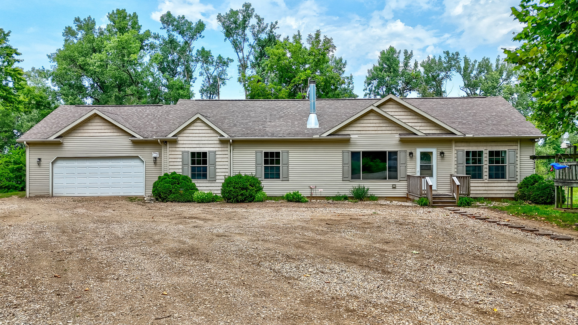 931 Highway 26 Magnolia, IL 61336 - Photo 5 of 35 a front view of a house with a garden and yard