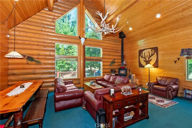 a outdoor living area with patio a couch and a fireplace