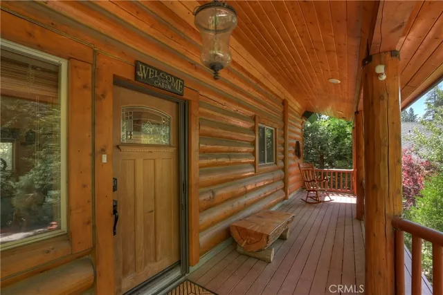 a view of a house with wooden floor and wooden fence