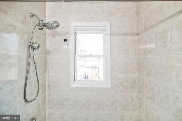 a bathroom with a sink toilet and mirror