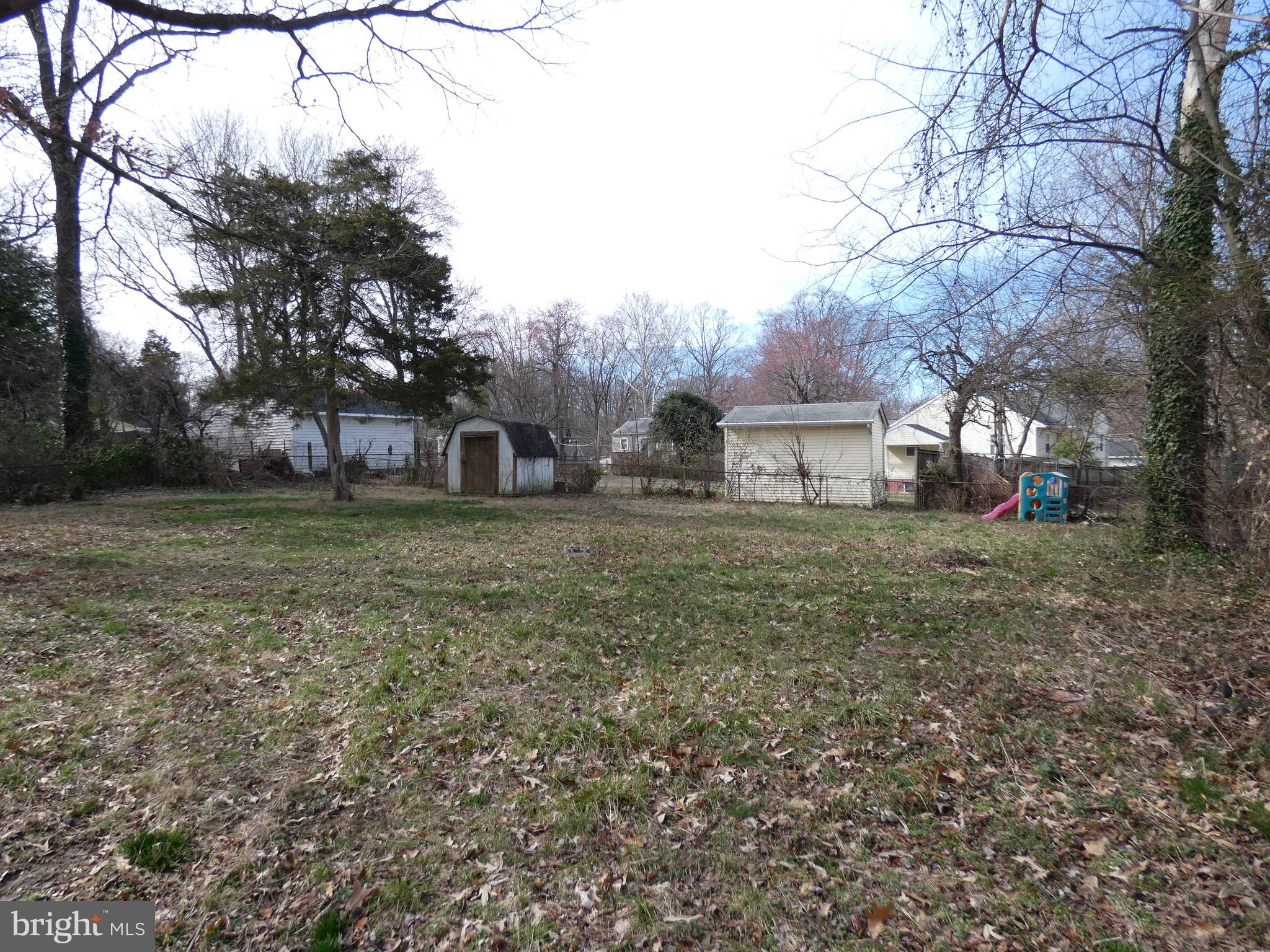 13426 Greenacre Drive Woodbridge, VA 22191 - Photo 26 of 45 a view of a house with a yard