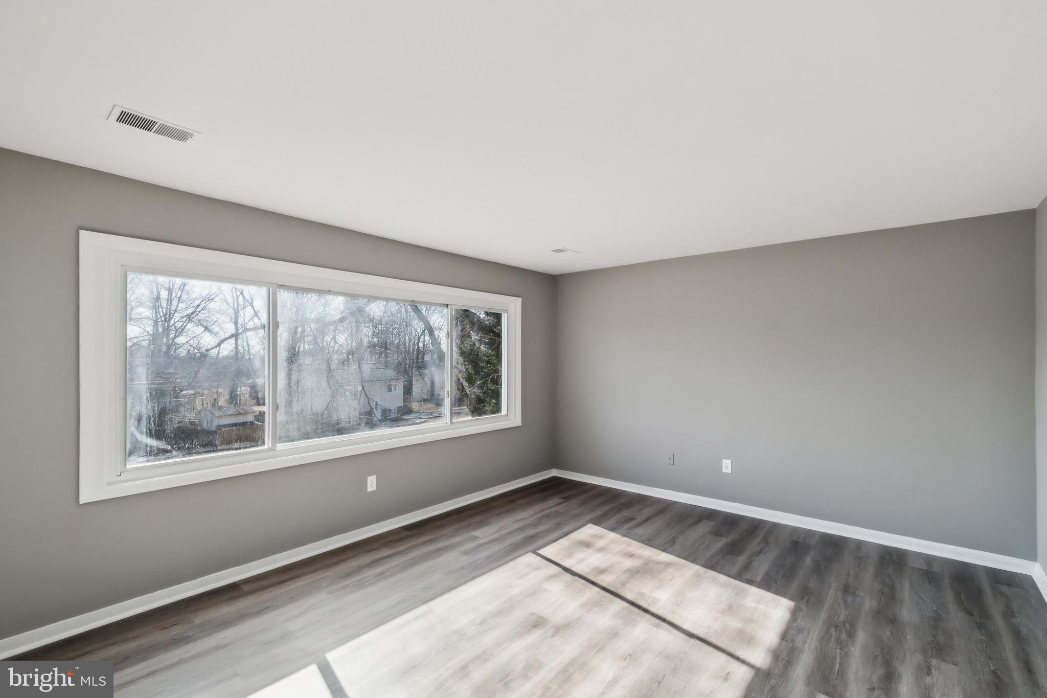 13426 Greenacre Drive Woodbridge, VA 22191 - Photo 3 of 45 a view of an empty room with a window