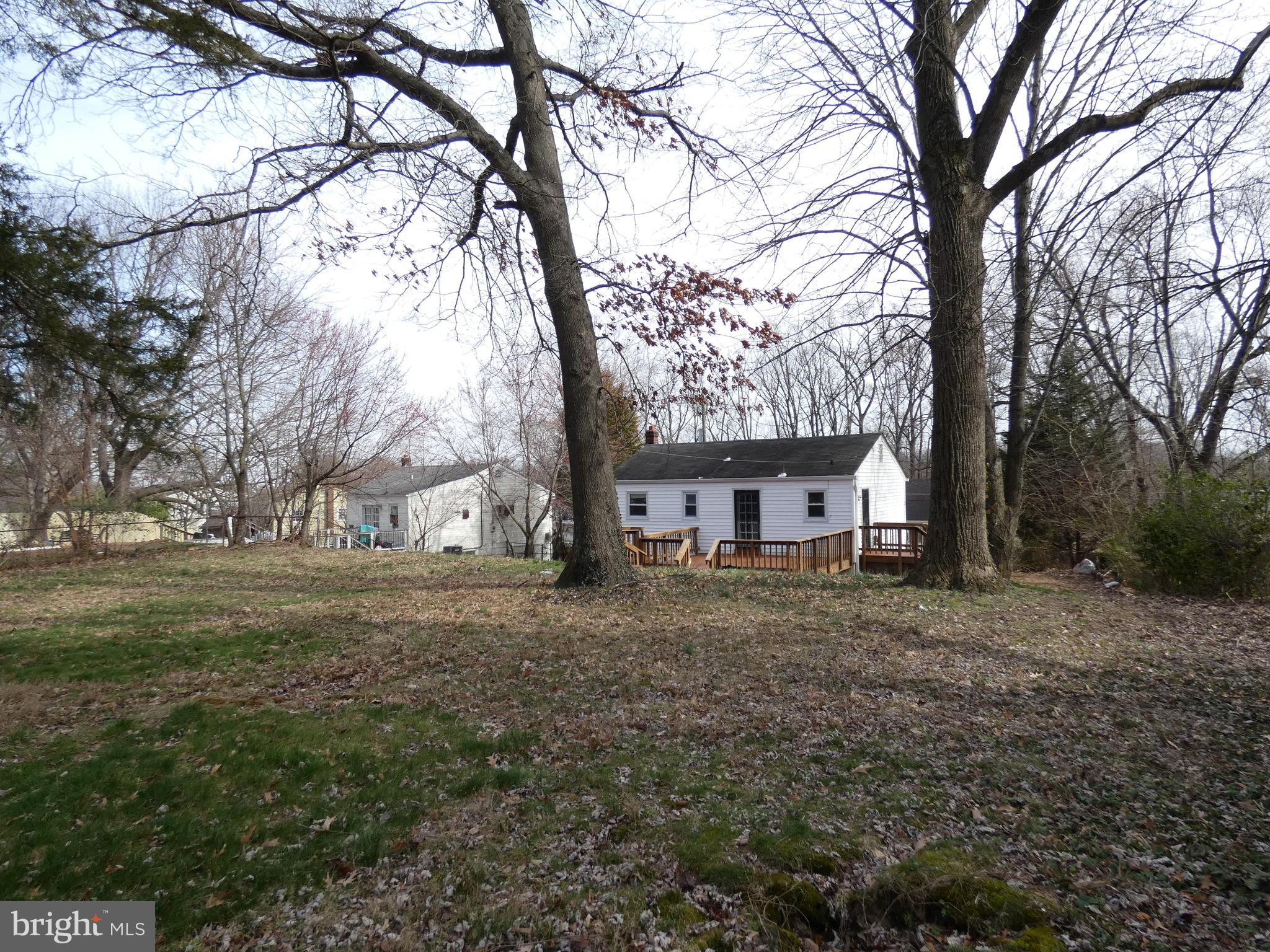 13426 Greenacre Drive Woodbridge, VA 22191 - Photo 32 of 45 a view of a house with a yard