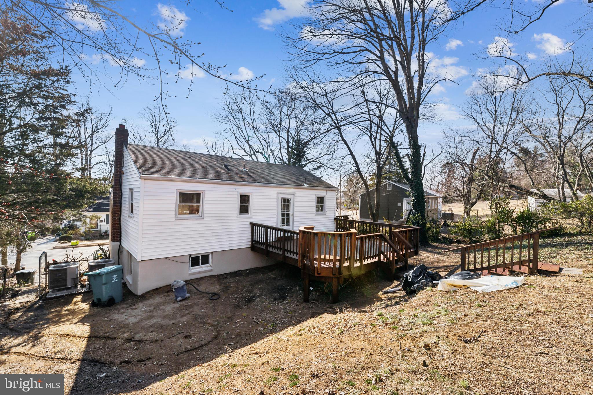 13426 Greenacre Drive Woodbridge, VA 22191 - Photo 36 of 45 a view of a house with a yard covered in snow