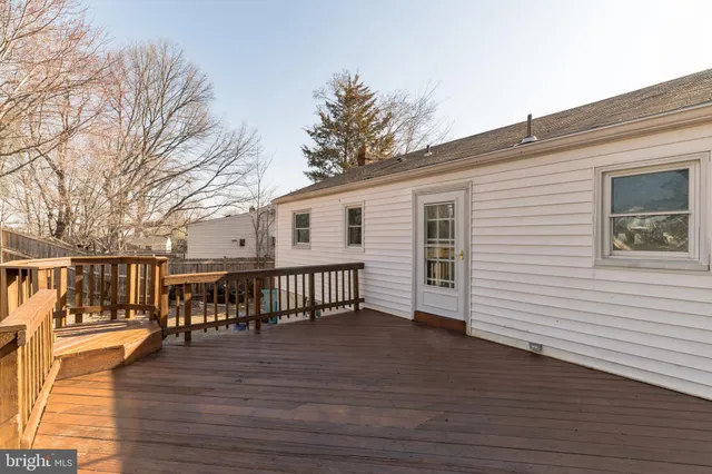 a view of a balcony with wooden floor