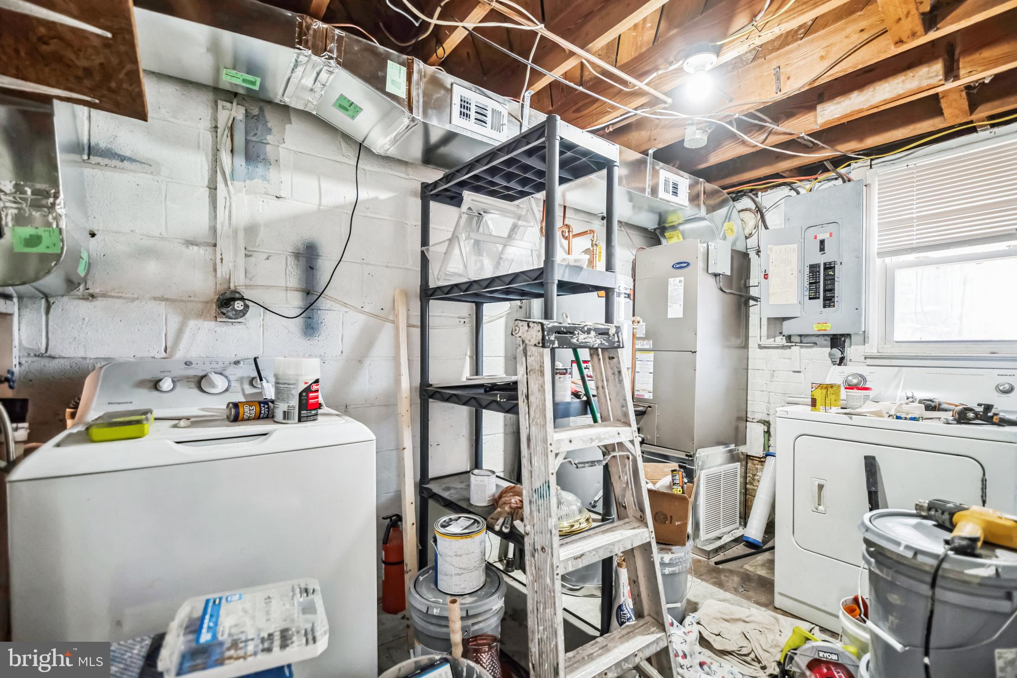 13426 Greenacre Drive Woodbridge, VA 22191 - Photo 40 of 45 a utility room with multiple dryer and washer