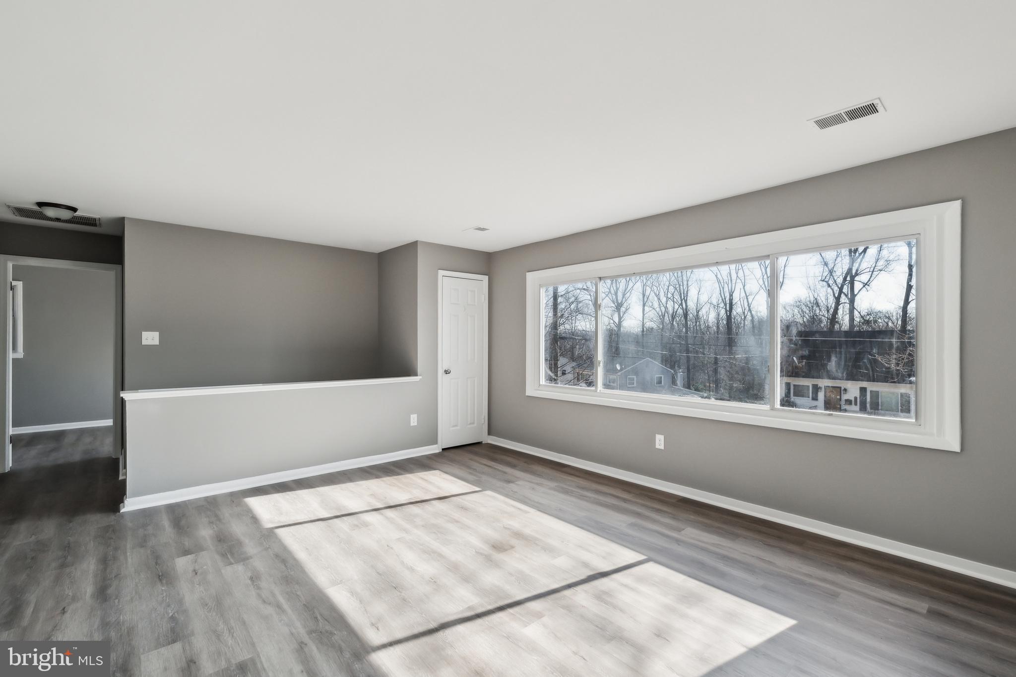 13426 Greenacre Drive Woodbridge, VA 22191 - Photo 4 of 45 a view of an empty room with a window
