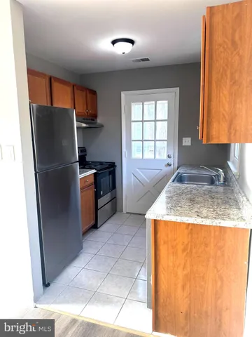 a kitchen with a stove and a cabinet