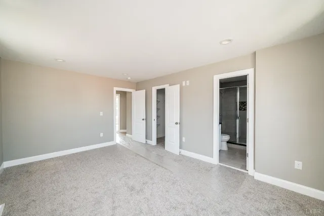 an empty room with closet area