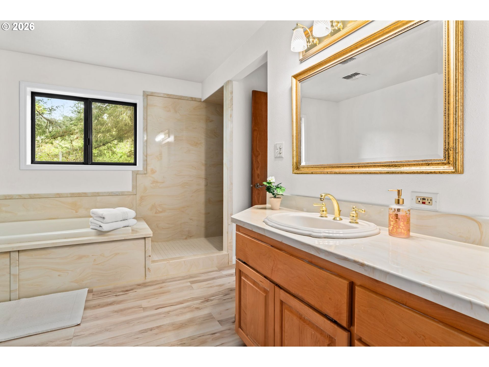 93933 Marcola Road Marcola, OR 97454 - Photo 13 of 35 a bathroom with a sink a mirror and a bathtub