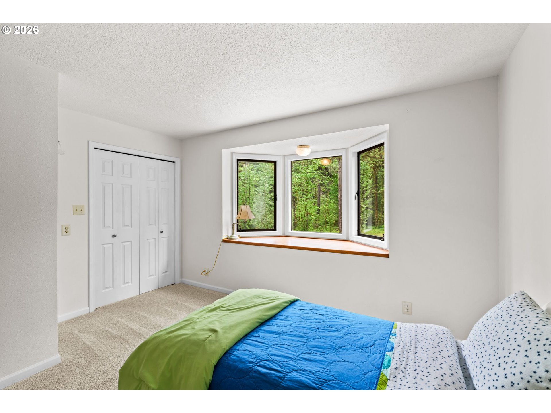 93933 Marcola Road Marcola, OR 97454 - Photo 14 of 35 a bedroom with a bed and a window