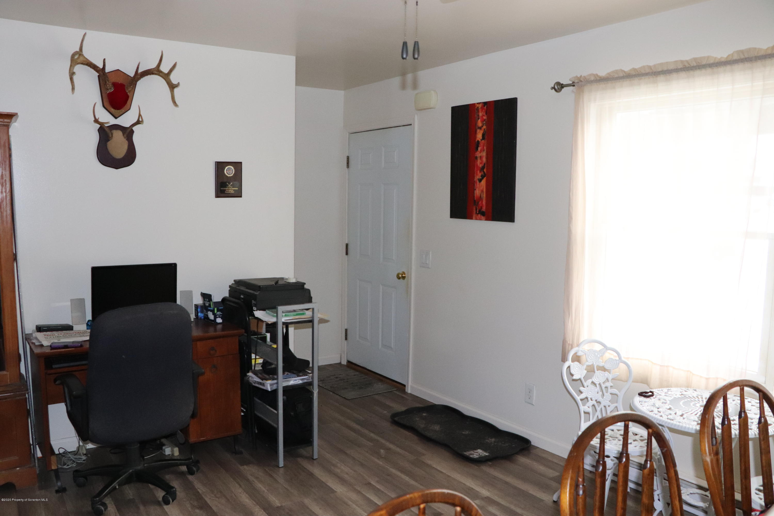 30 Brookside Road Tunkhannock, PA 18657 - Photo 6 of 47 a view of a workspace with furniture and wooden floor