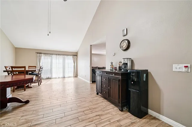 a view of a dining hall with wooden floor and furniture