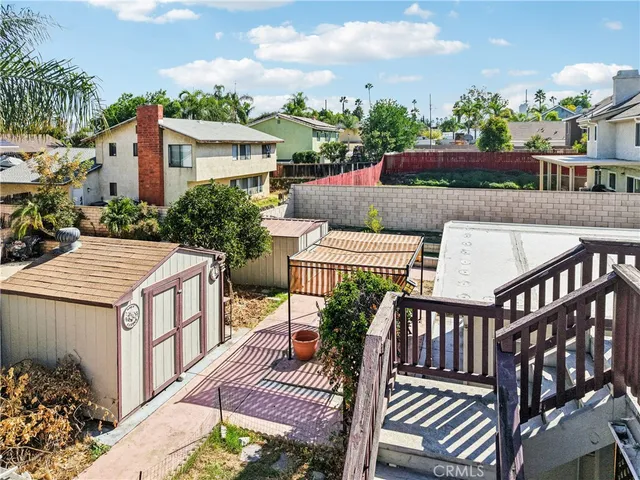 an aerial view of a residential houses with outdoor space