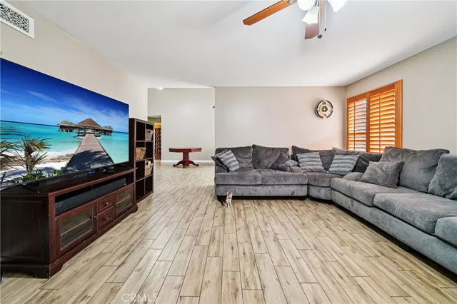 a living room with a couch and a flat screen tv