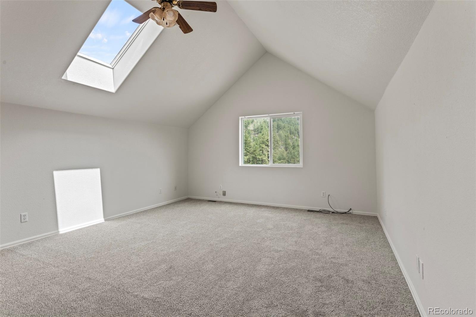 12183 Arnett Ranch Road Littleton, CO 80127 - Photo 19 of 28 an empty room with windows