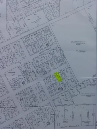 a view of a lake in between two chairs